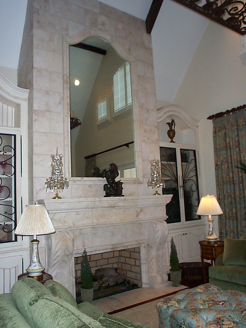 Arched above fireplace